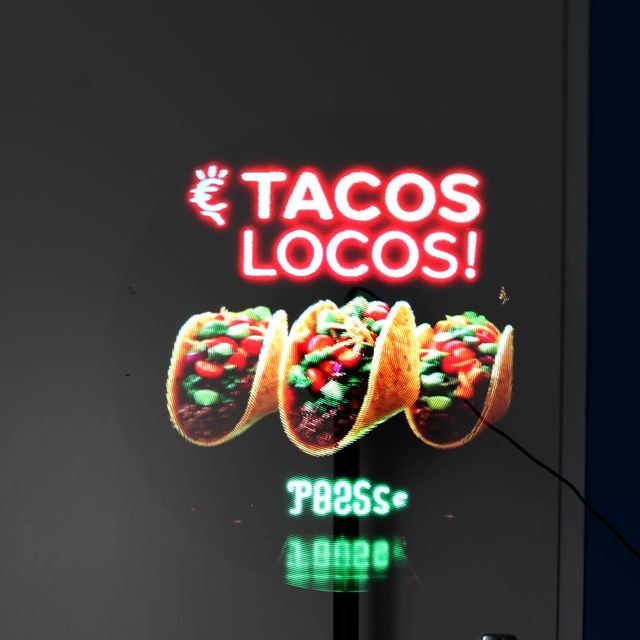 Hologram met de tekst Tacos Locos en drie taco's